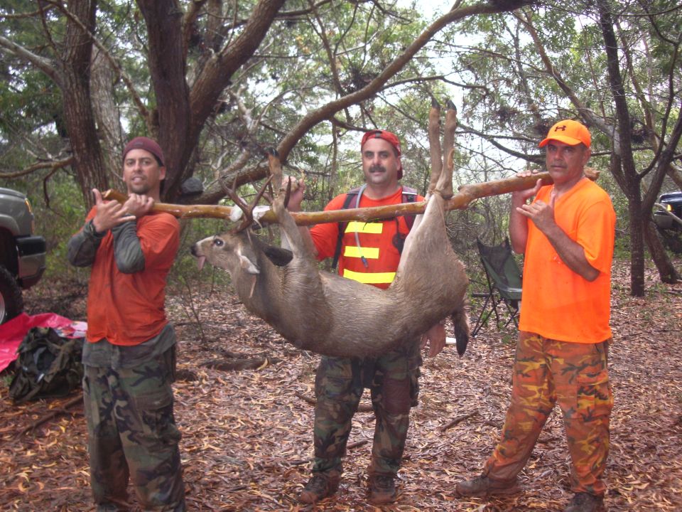 Toby and his uncle in center with Richards super rare Kauai 8 point buck.
