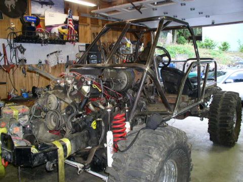 1979 Ford Bronco - Custom buggy under construction, showing its exposed engine and roll cage structure.