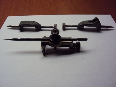 1965 Ford Mustang - A Stanley marking gauge and two of its attachments are displayed on a white surface.