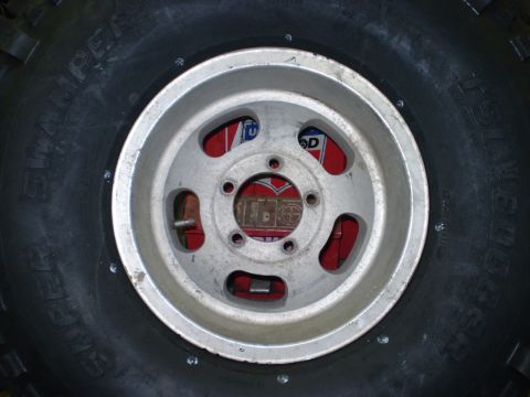 1979 Ford Bronco - Tire and wheel assembly, likely from an off-road vehicle.