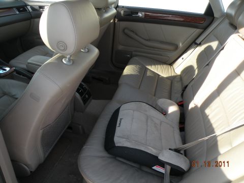 2000 Audi A6 - Rear interior view of a 2000 Audi A6, leather seats and a child booster seat.