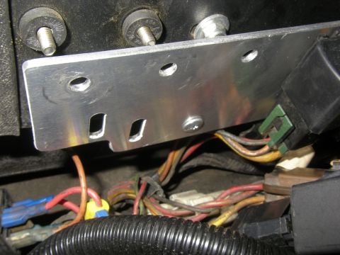 1990 Ford Bronco - Automotive wiring harness and relay assembly with a custom metal bracket.