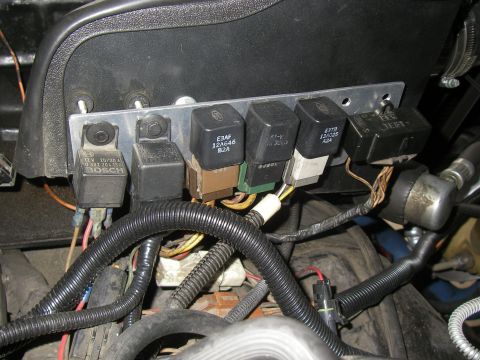 1990 Ford Bronco - A shop-made aluminum relay bracket bolted under the dash or fender panel holds six relays in a row, including a Bosch 12V 20/30A cube and F…