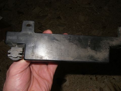 1990 Ford Bronco - This is a Ford fuel pump relay housing with various labels indicating its function and testing modes.