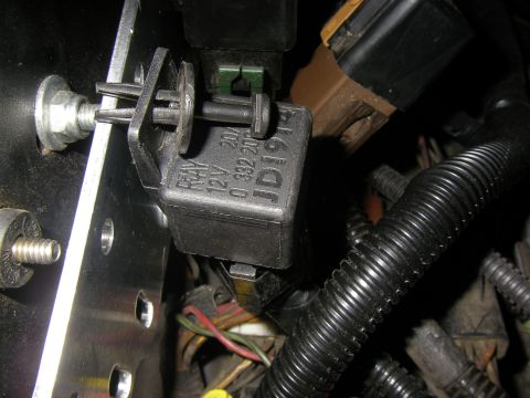 1990 Ford Bronco - Close-up view of an automotive relay, part of the vehicle's electrical system.