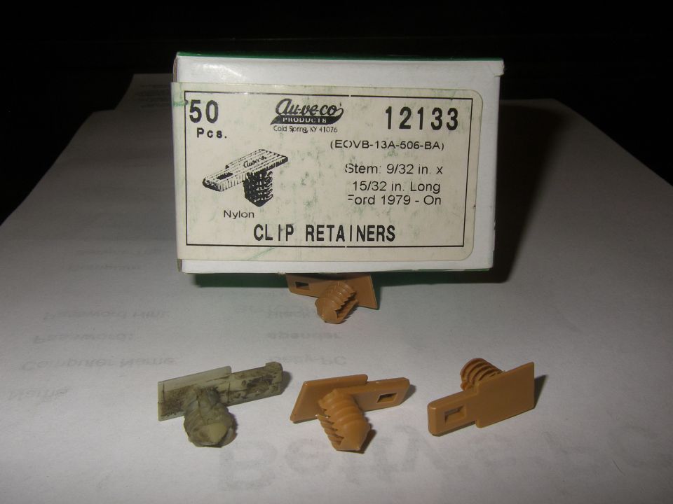 Box of Au-veco clip retainers with three retainers shown