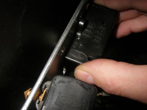 1990 Ford Bronco - Close-up of a Ford relay module, showing text that reads 'EEC TEST'.