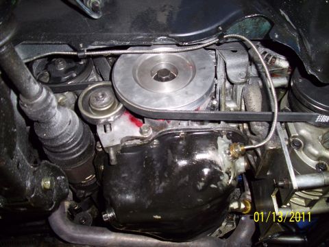 1995 Ford Probe - Engine oil pan and drive belt system detail, showing pulleys and tensioner.