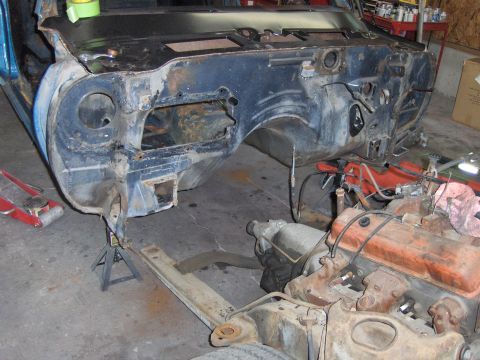 1970 Chevrolet Camaro - The disassembled front end of a 1970 Chevrolet Camaro is shown with the engine out of the vehicle.