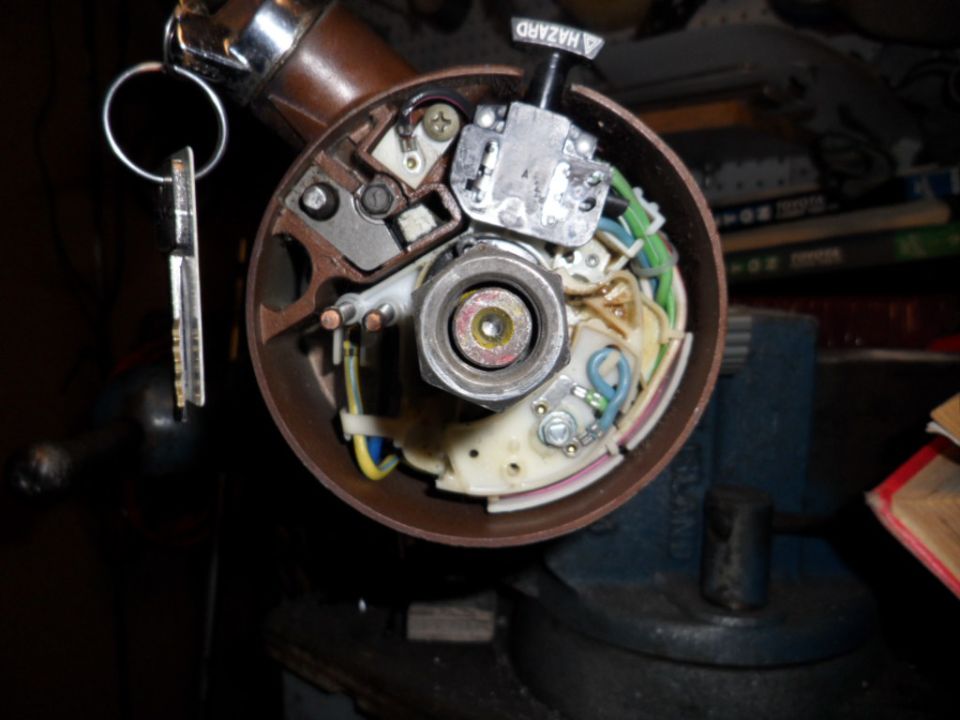 car ignition switch assembly with keys in a vise