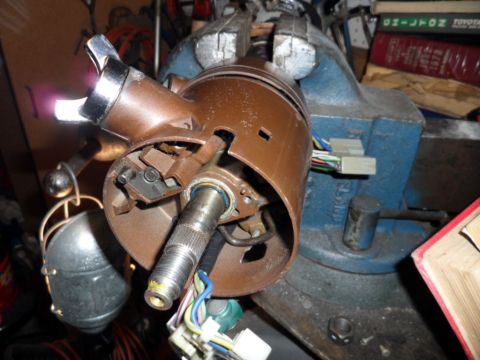 1973 Ford Ranchero - A disassembled steering column assembly is secured in a vise, showing internal components and wiring.