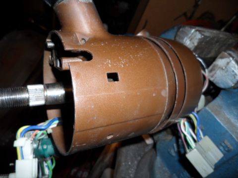 1973 Ford Ranchero - Close-up view of a brown steering column housing with visible wiring and connectors.