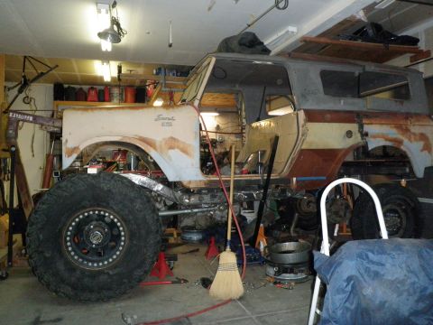 1961 International Scout 800 - This 1961 International Scout is in a state of disassembly, showing its frame and large off-road tires.