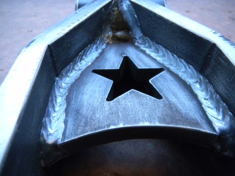 1997 Ford Ranger - A custom metal part features a prominent star cutout, surrounded by expertly done welds.