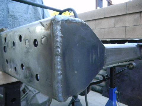 1997 Ford Ranger - Close-up of a custom-fabricated axle housing, showing extensive welding and drilled holes.