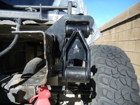 1997 Ford Ranger - Custom suspension part with a star design, attached to the rear of a truck.