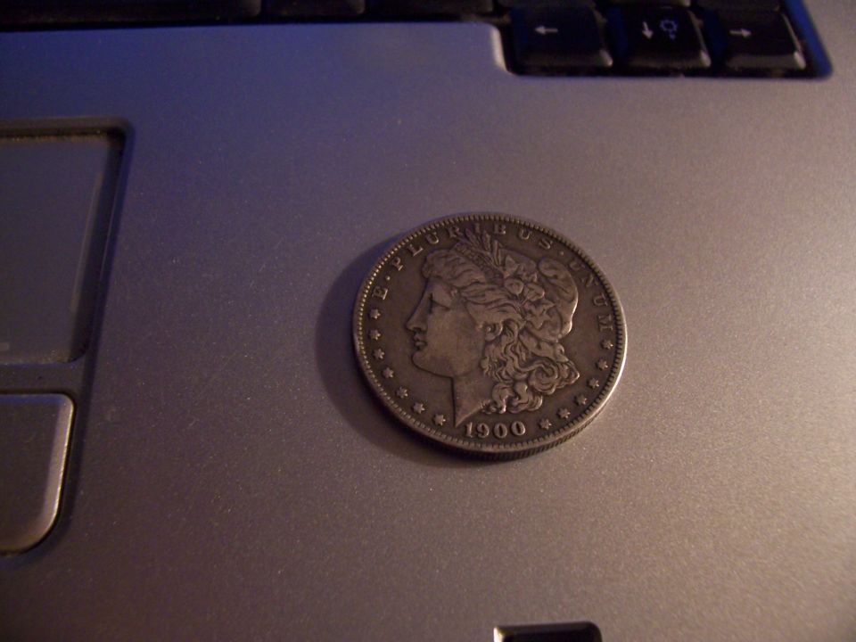 Silver dollar coin with profile of Liberty and year 1900
