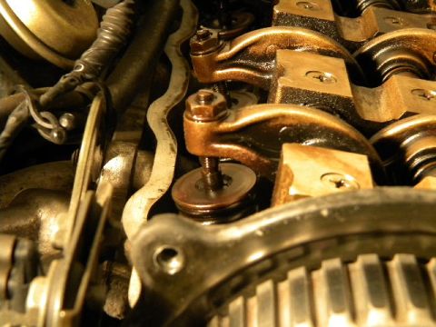 1988 Ford Bronco - This image shows the internal components of an engine's valve train, including rocker arms and springs.