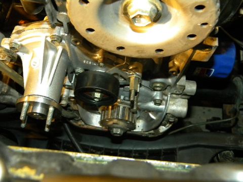 1988 Ford Bronco - Engine components including water pump and timing belt pulley are visible in this close-up shot.