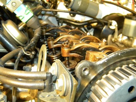 1988 Ford Bronco - Close-up view of an engine's internal components, including the valve train and a timing gear.
