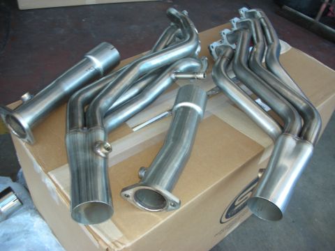 2004 Ford Crown Victoria - Set of stainless steel exhaust headers and pipes, likely for an aftermarket upgrade.