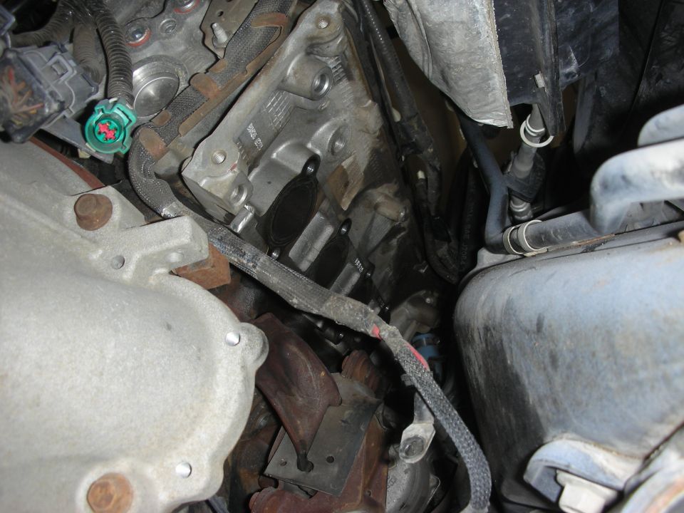 Engine block, exhaust manifold, and wiring harness with connectors