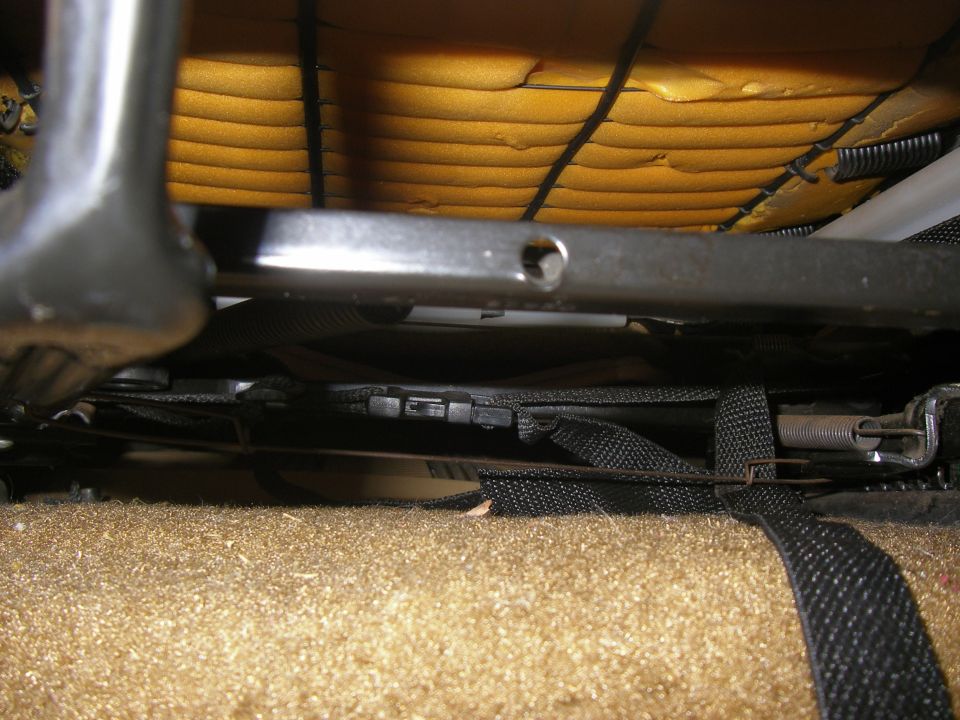Seat mechanism with yellow foam and black straps
