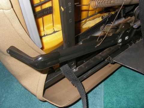 1990 Ford Bronco - The inner workings of a vehicle seat, showing the metal frame, springs, and adjustment mechanism.