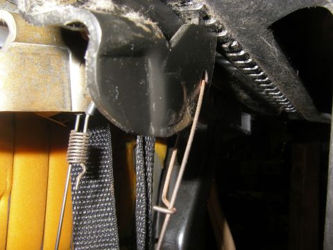 1990 Ford Bronco - Close-up view of a vehicle's seat slider mechanism, revealing its internal workings and springs.