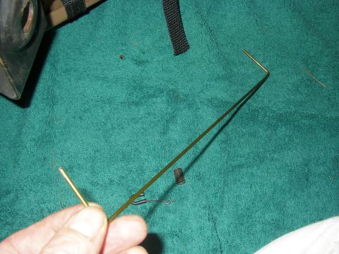 1990 Ford Bronco - Repair part for a vehicle, possibly a slider mechanism, shown on a green towel.