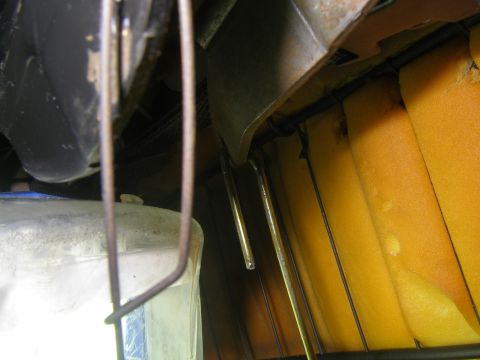 1990 Ford Bronco - Close-up of the seat's internal mechanism and exposed foam padding, possibly related to seat adjustment or repair.