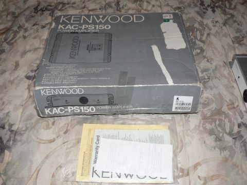 1978 Ford Bronco - A Kenwood KAC-PS150 power amplifier box is shown with its accompanying warranty card and manual.