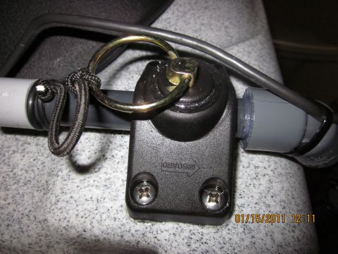 1953 Ford Mainline - A close-up view of a kayak outrigger mount with a metal ring and black cord.