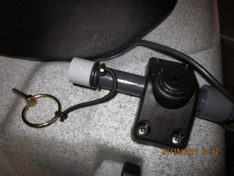 1953 Ford Mainline - Close-up of a kayak accessory mount, a bungee cord and securing pin, with a timestamp of 01/15/2011.