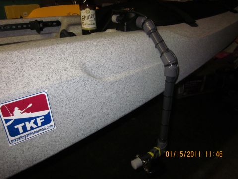 1953 Ford Mainline - Kayak with plumbing attachment and a Shiner beer bottle visible. Date stamp indicates 2011.