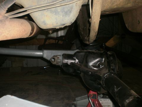 1995 Ford Bronco - Close-up view of the undercarriage, focusing on suspension and exhaust components.