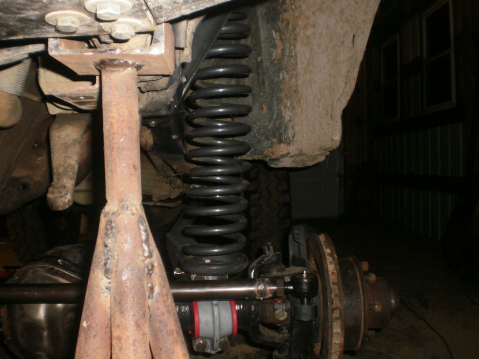 Suspension components and jack stand under a vehicle