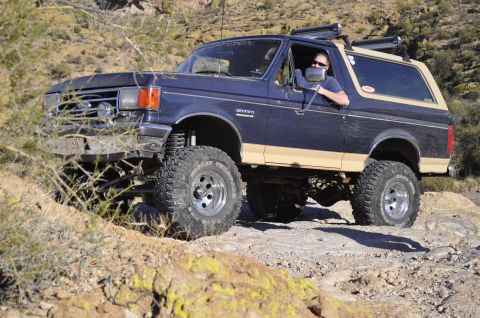 1991 Ford Bronco - This 1991 Ford Bronco is navigating a challenging off-road trail.