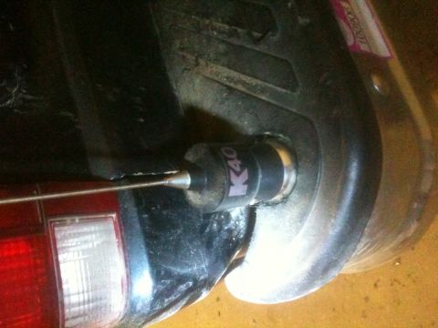 1993 Ford Bronco - A K40 antenna is mounted on the rear bumper of a vehicle, near the taillight assembly.