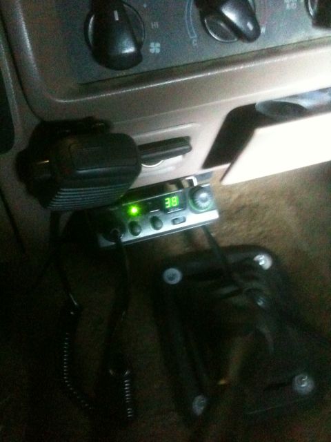 1993 Ford Bronco - CB radio and microphone installed in the interior of a vehicle, with the radio displaying '38'.