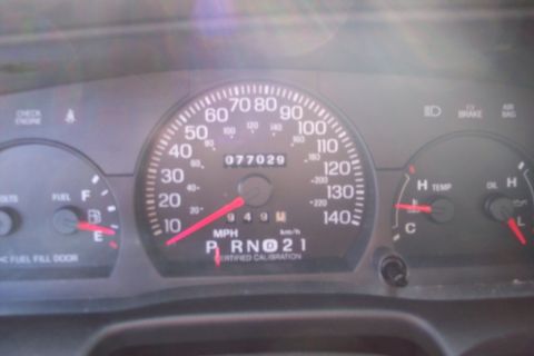 2001 Ford Crown Victoria - Dashboard gauges of a 2001 Ford Crown Victoria show an odometer reading of 77,029 miles.