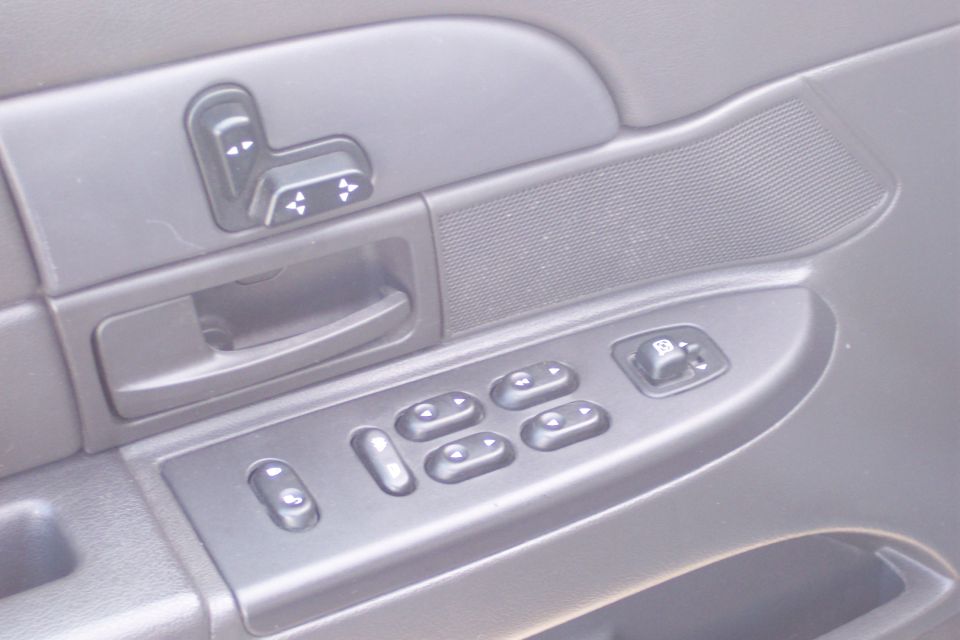 Interior door panel with power window and seat controls