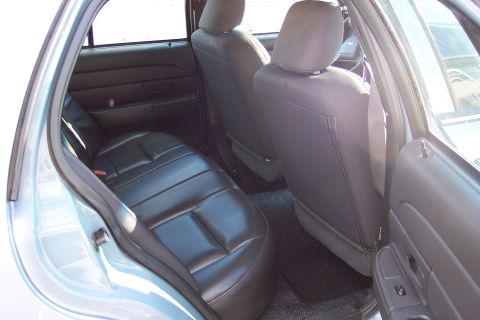 2001 Ford Crown Victoria - The interior of a 2001 Ford Crown Victoria is viewed from the rear passenger side.