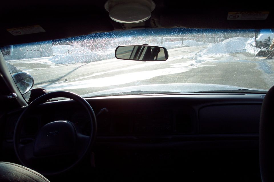 Interior view of 2001 Ford Crown Victoria police car, dashboard and steering wheel visible