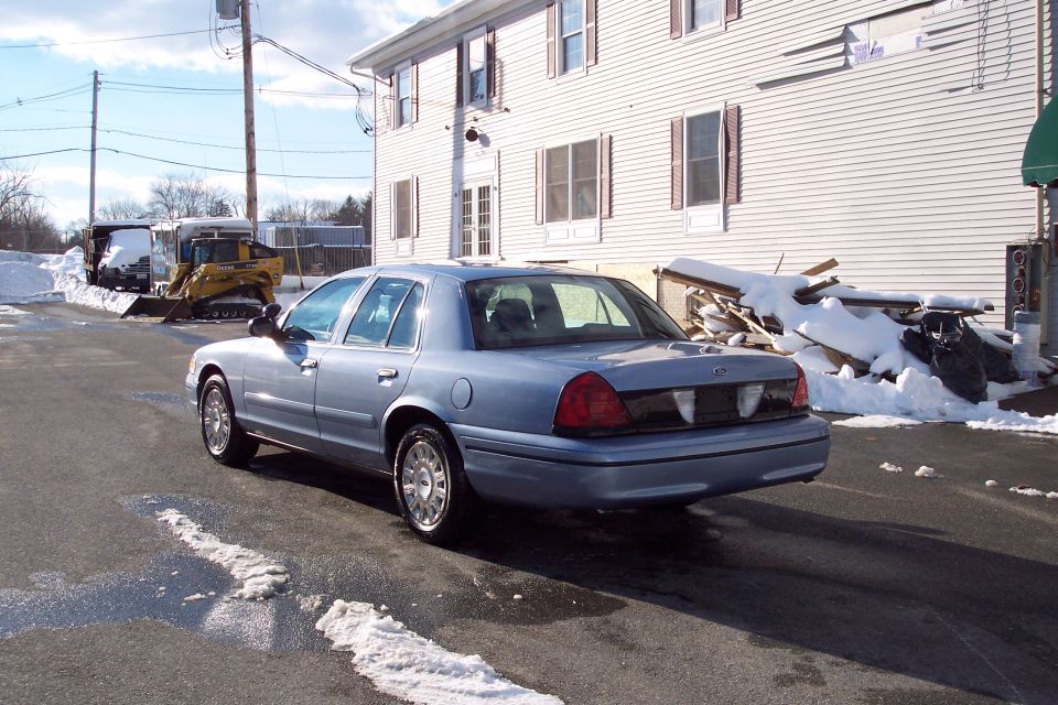 Light blue 2001 Ford Crown Victoria rear view