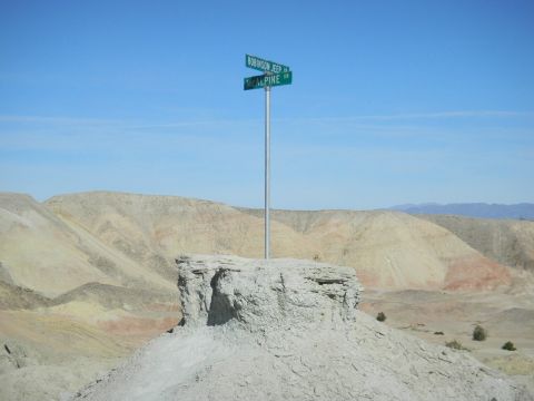 1997 Ford Ranger - A signpost indicates Robinson Jeep and McAlpine streets in a barren desert landscape.