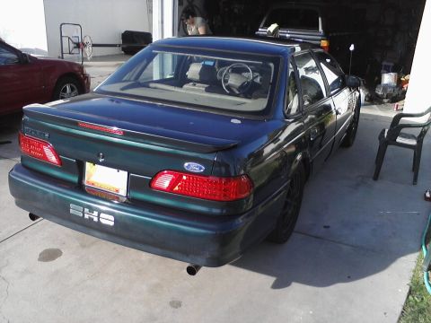 1995 Ford Taurus - Rear view of a 1995 Ford Taurus SHO, showing its distinctive taillights and badging.