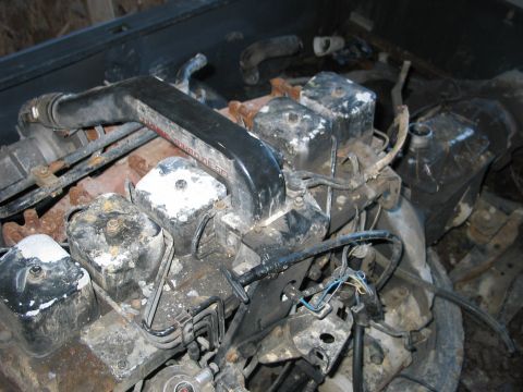 1984 Ford Bronco - This is a diesel engine with visible wiring and hoses, appearing to be disassembled or in storage.
