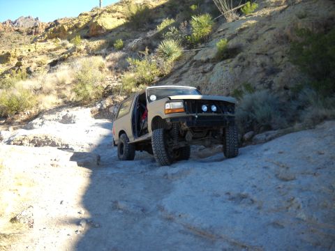 1996 Ford Bronco - This 1996 Ford Bronco navigates a challenging off-road course in a desert landscape.