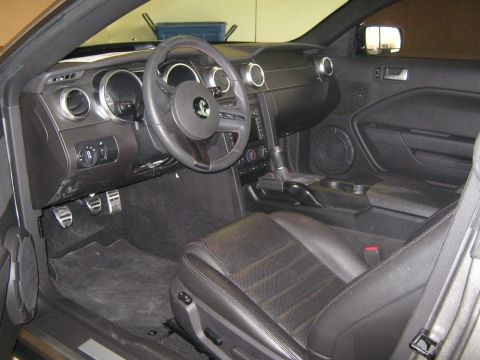 2000 Mercury Grand Marquis - The interior of a car is shown, the dashboard, steering wheel, and seats.